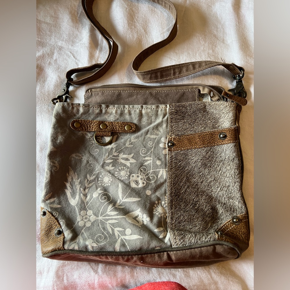 Myra Bag with Mixed Materials. Crossbody. Cow hide mixed with a floral design.